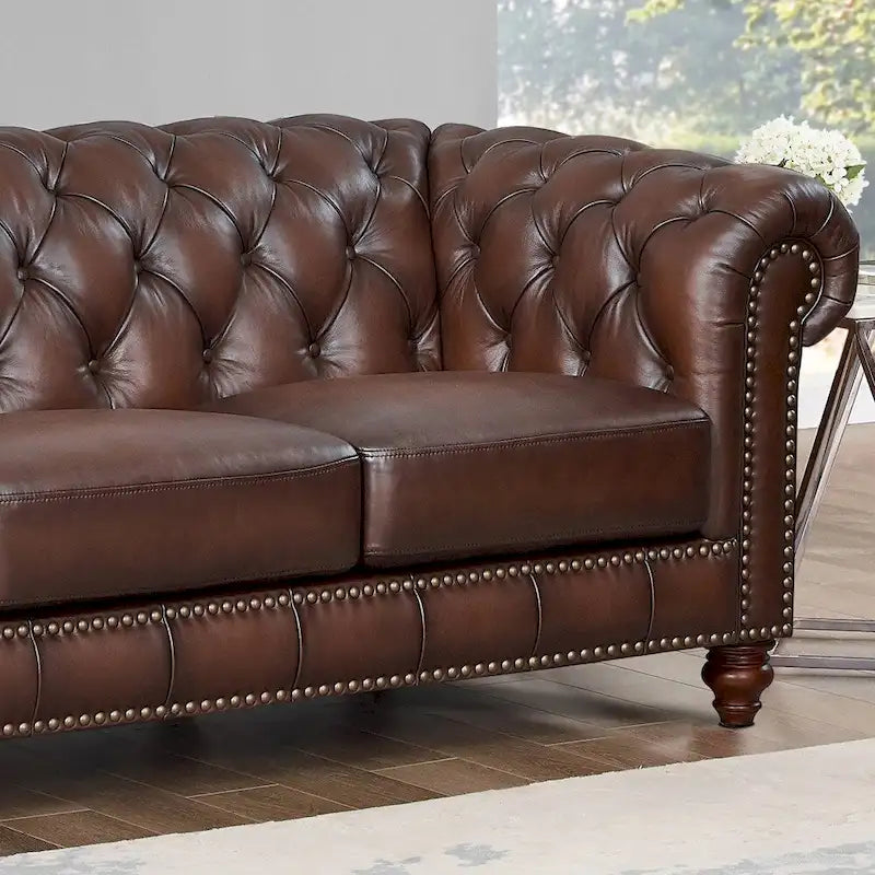 Divano e poltrona Chesterfield in pelle pieno fiore