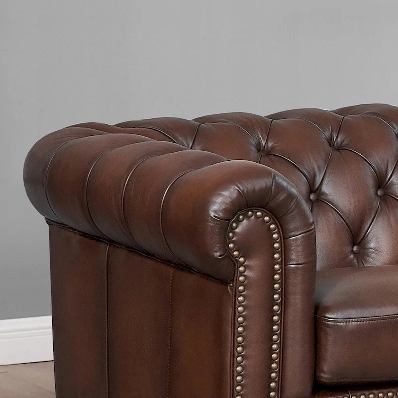Divano e poltrona Chesterfield in pelle pieno fiore
